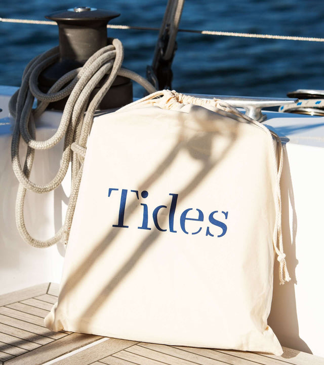 Portable winch seat for sailboat displayed on a sailboat deck with Tides branding.